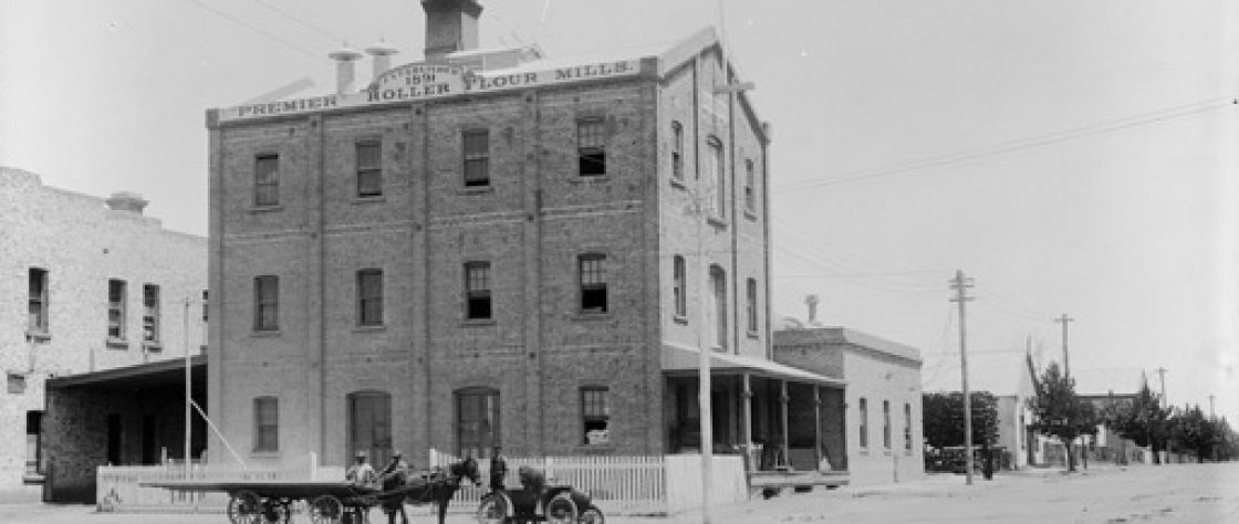 The Premier Roller Flour Mills in Katanning circa 1903. This historical photograph shows the Mill a decade after opening remained largely unchanged, here a horse and cart is stationed outside of the Mill on what is now Austral Terrace in the town of Katanning.