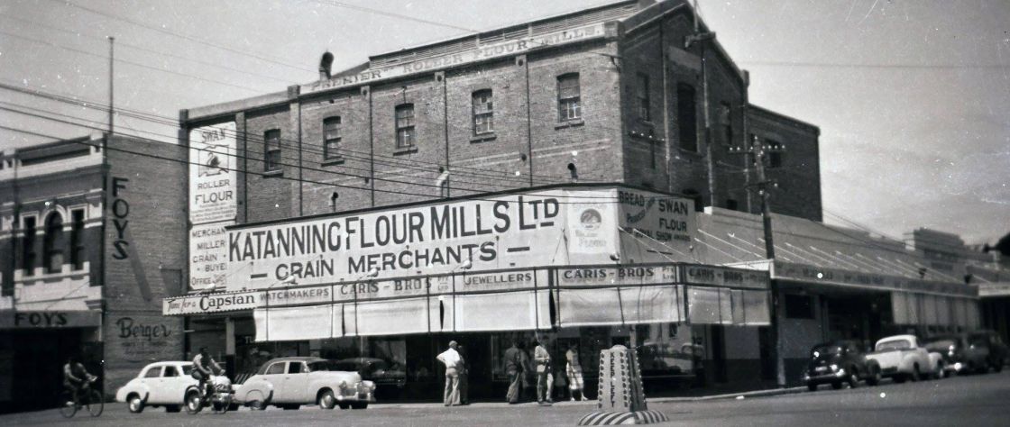 In the 1930's an addition of shops fronting the Mill allowed locals to purchase more than just flour when they visited the mill. This photo shows the front of the Premier Flour Mill and it's changing signage with the addition of 'The Wattle' cafe on the Austral Terrace side.
